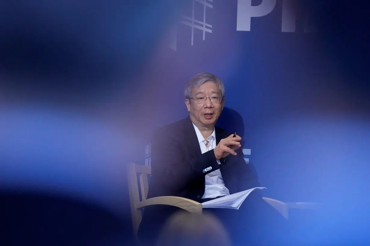 Governor of the Peoples Bank of China, Yi Gang speaks to the media at the Peterson Institute for International Economics, in Washington D.C