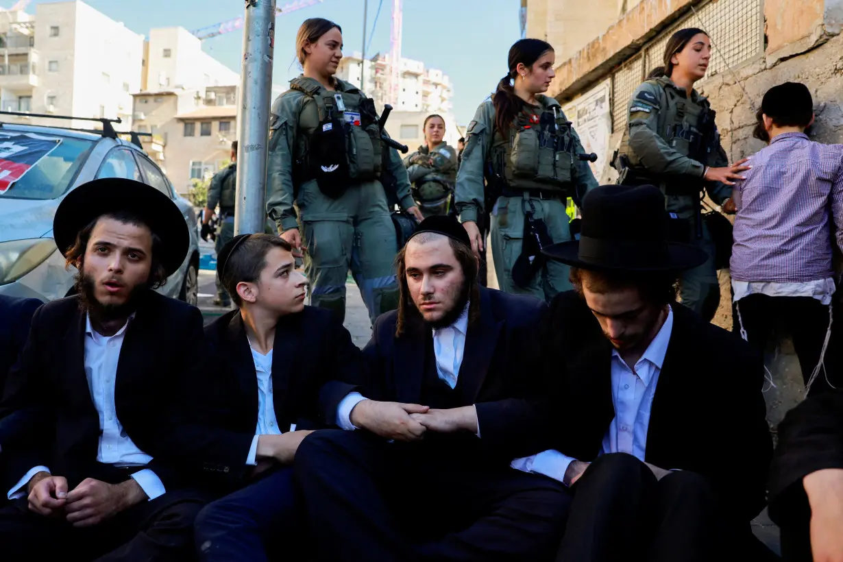 FILE PHOTO: Ultra-Orthodox Jewish men protest against attempts to recruit men from the community, in Jerusalem