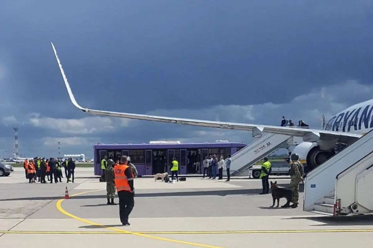 FILE PHOTO: Airport personnel and security forces are seen on the tarmac in front of a Ryanair flight which was forced to land in Minsk