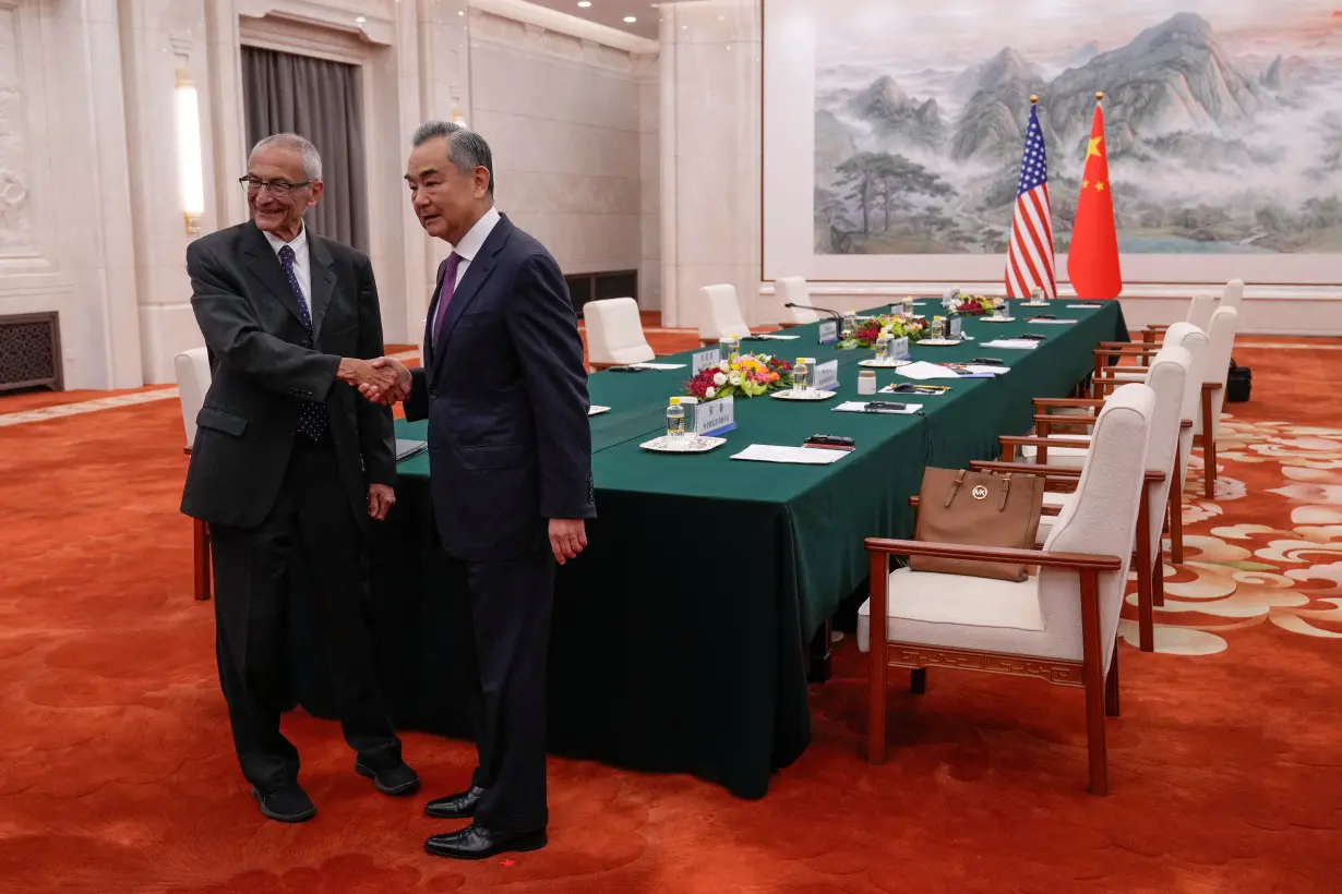 White House Senior Advisor for Clean Energy John Podesta meets with China's Foreign Minister Wang Yi in Beijing