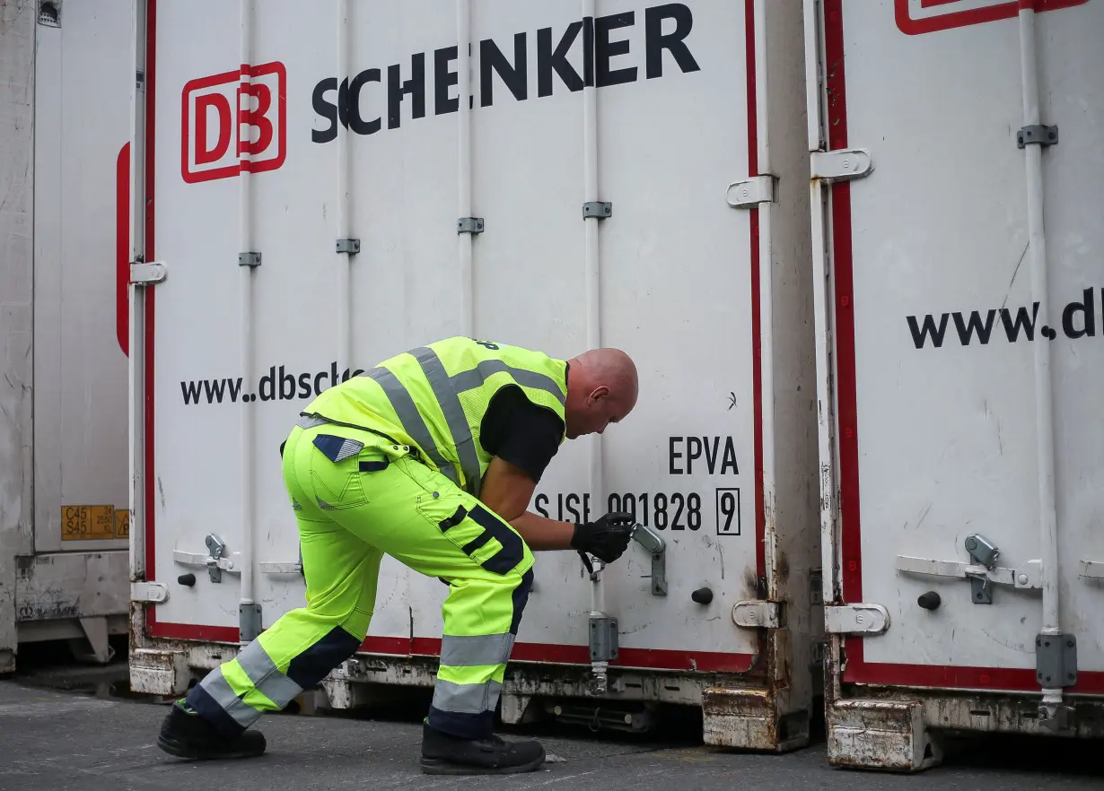 FILE PHOTO: A DCP (Dettmer Container Packing) employee checks the container during a press tour of Deutsche Bahn logistics unit Schenker at the harbour in Hamburg