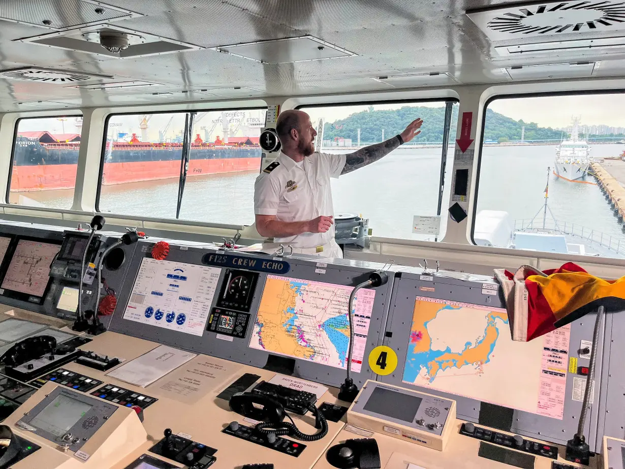 A German naval officer stands on the bridge of the frigate FGS Baden-Wurttemberg, docked in Incheon, as part of a two-ship cruise through the Indo-Pacific