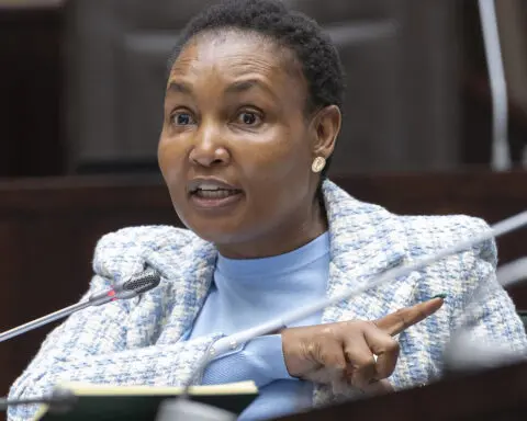 South Africa's justice minister denies corruption allegations against her in a mutual bank scandal