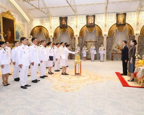Thailand's king swears in new government after turmoil