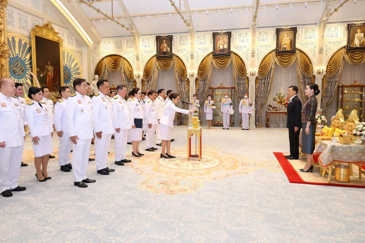 Thailand's king swears in new government after turmoil