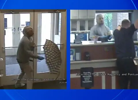 Suspect robs bank wearing "old man" mask, carrying polka dot umbrella, police say