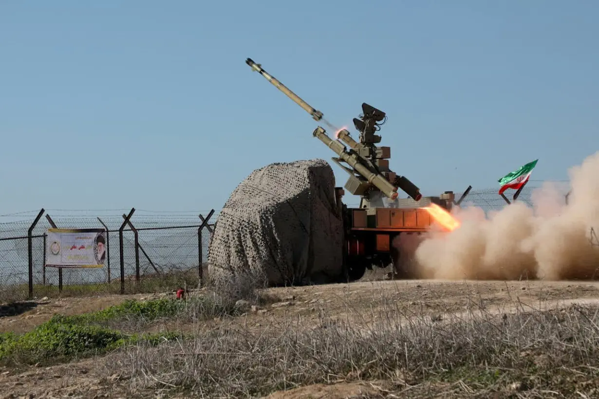 A missile is launched during a military exercise in an undisclosed location in the south of Iran