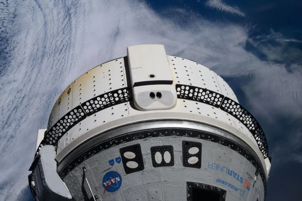 Boeing's Starliner spacecraft is pictured docked to the International Space Station's forward-facing port of the Harmony module as the orbiting lab soared 264 miles above the Atlantic Ocean on June 15.