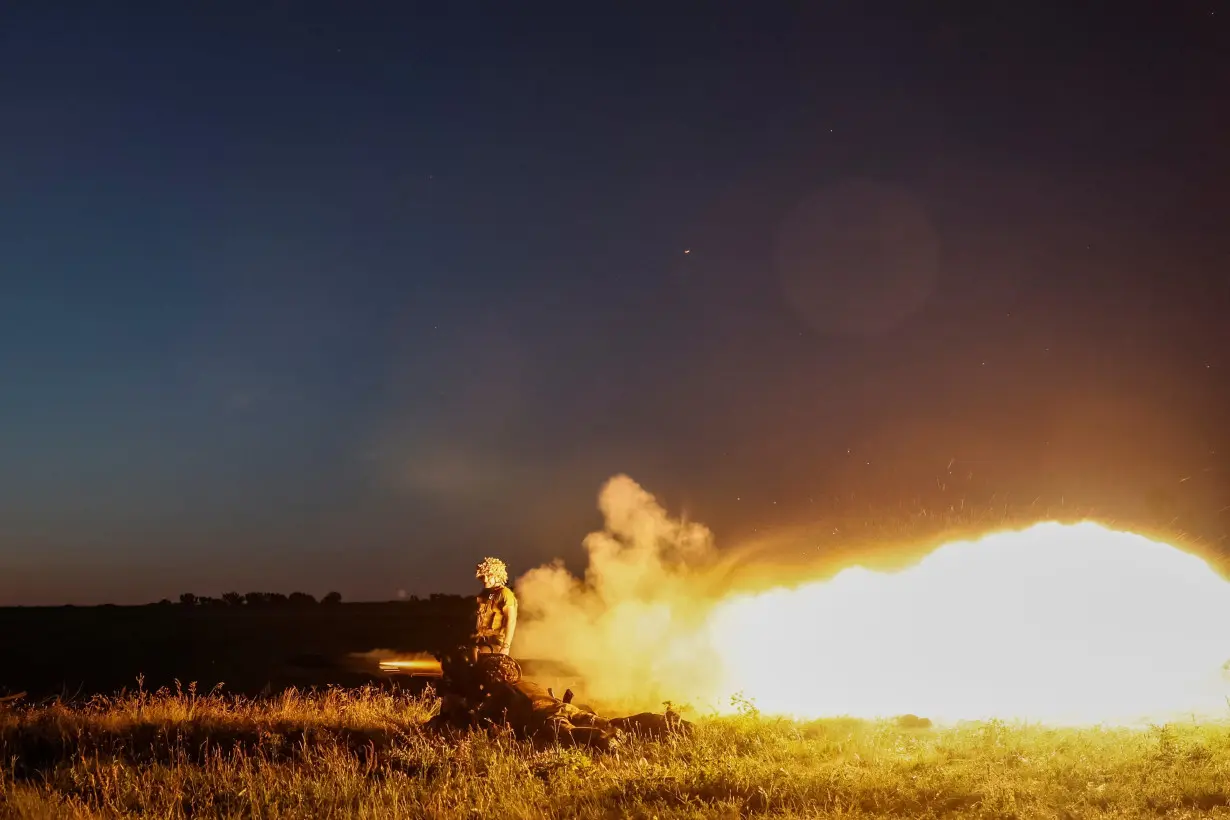 Ukrainian service members attend military drills near a frontline in Donetsk region