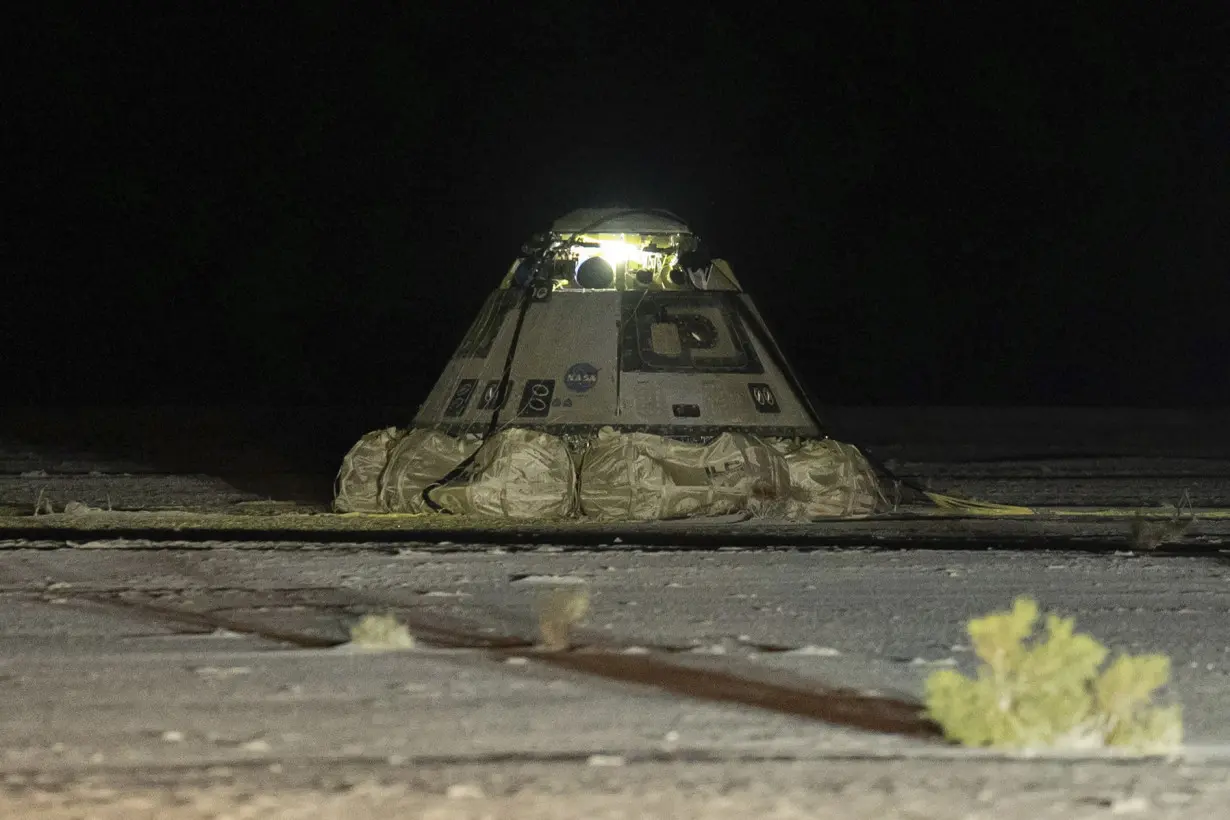 Two astronauts are left behind in space as Boeing's troubled capsule returns to Earth empty