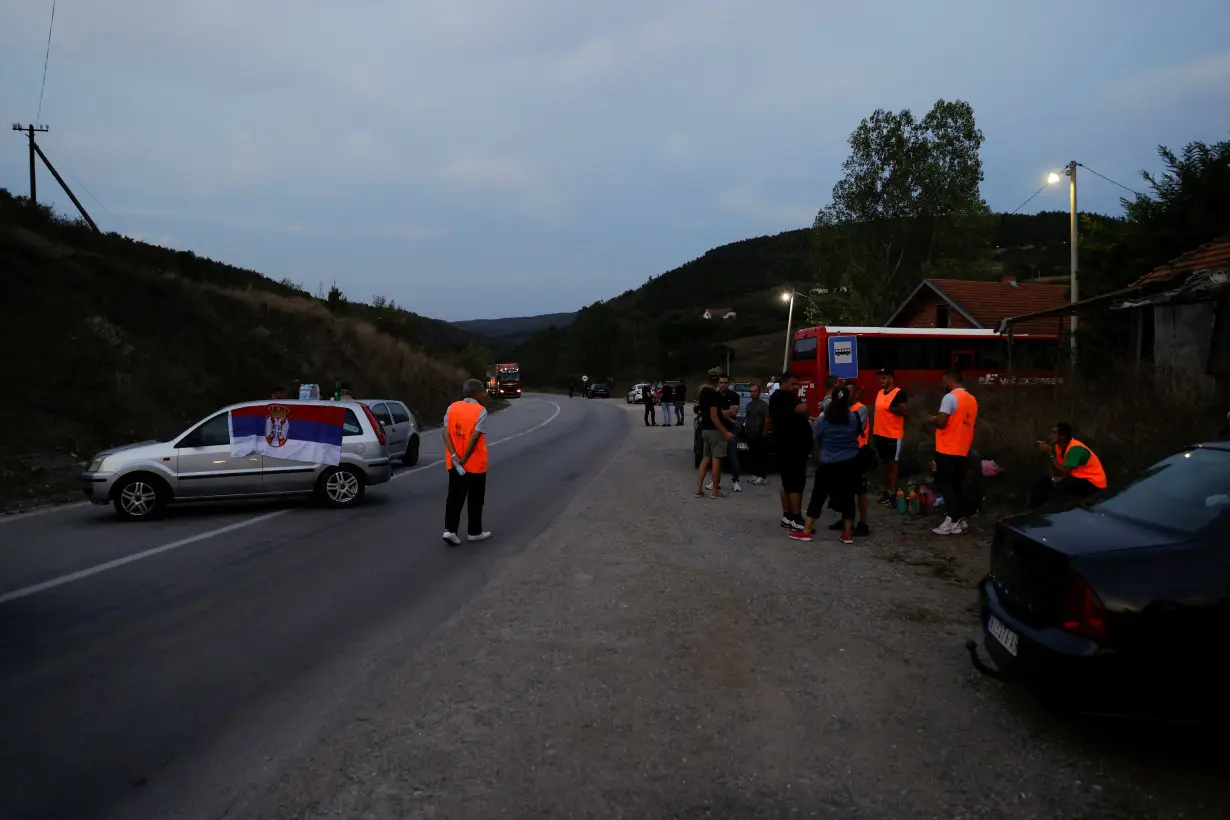 Protestors gather to partially block the road near the main Kosovo-Serbia border crossing in Merdare