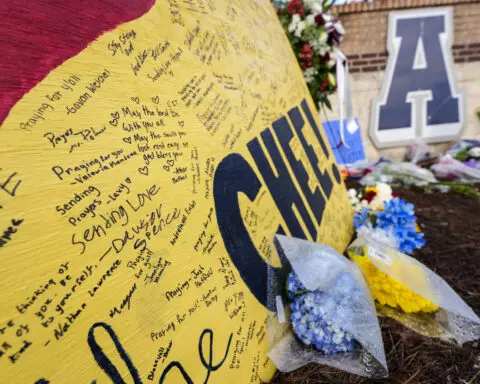 Mother of Georgia shooting suspect called school to warn of emergency, aunt says