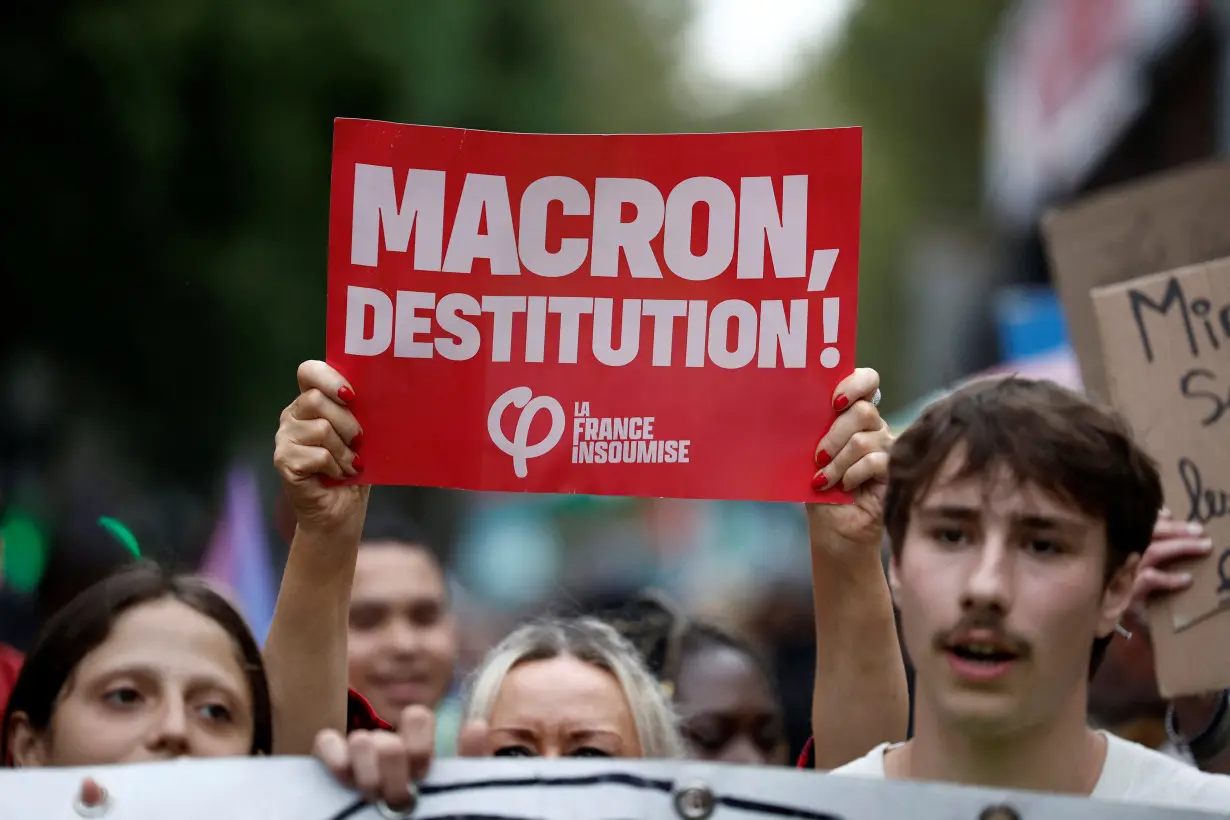 Demonstrators protest Macron's refusal to name leftist PM, in Paris