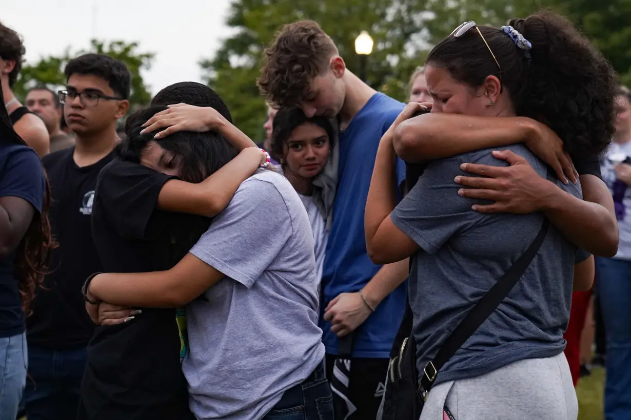 Community members, students, and faculty of Apalachee High School come together for a vigil on September 6 in Monroe, Georgia.