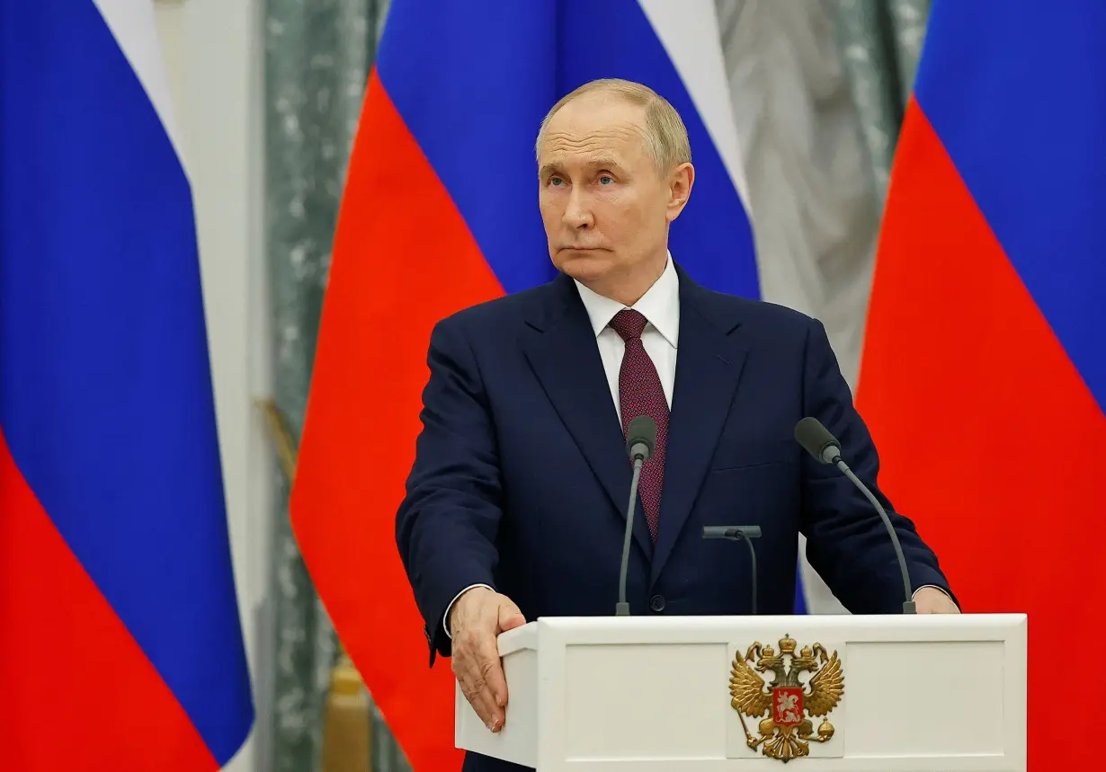 Russia's President Vladimir Putin attends a press conference with Hungary's Prime Minister Viktor Orban following their meeting in Moscow, Russia July 5.