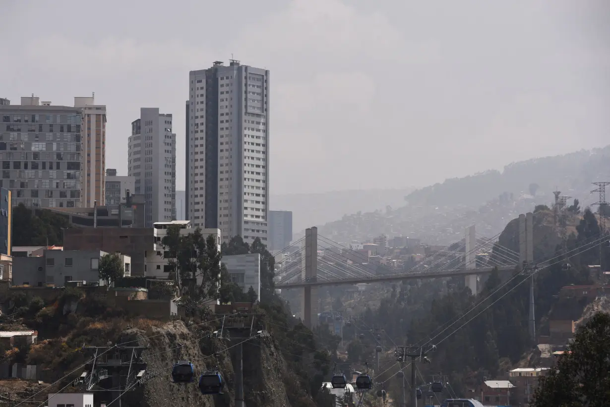 A smoky shroud from wildfires engulfs La Paz