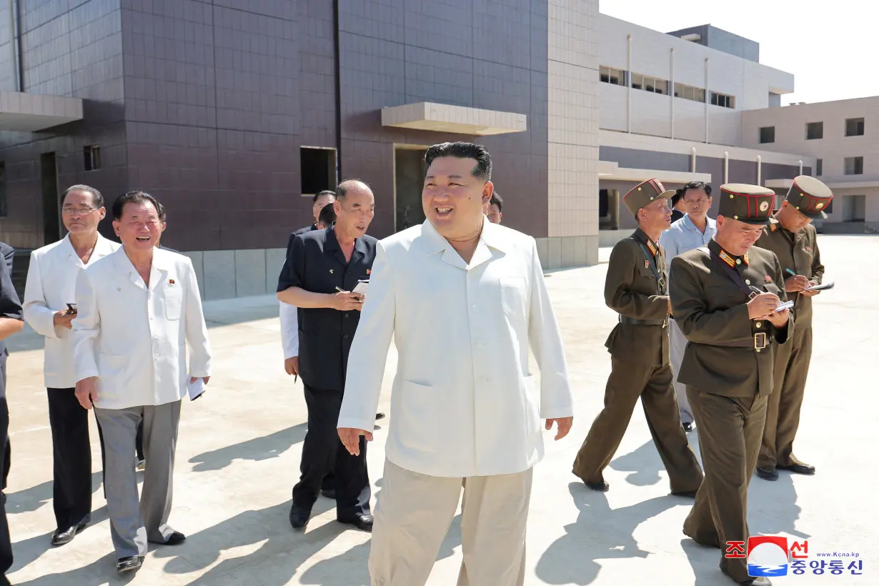 FILE PHOTO: North Korean leader Kim Jong Un visits the construction sites of various North Korean industrial factories