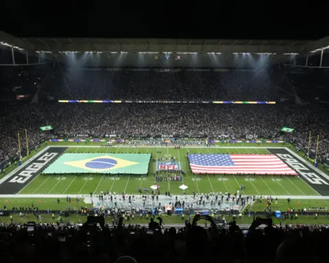 Some NFL fans defy host soccer club's preference by wearing green to Packers-Eagles game in Brazil