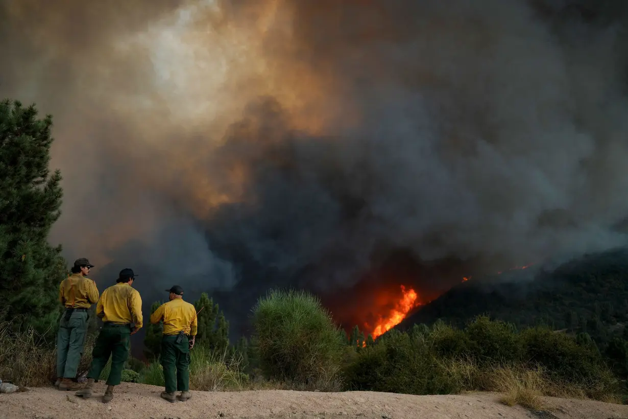 Fire crews monitor the Line Fire, in Running Springs, California, on September 7.