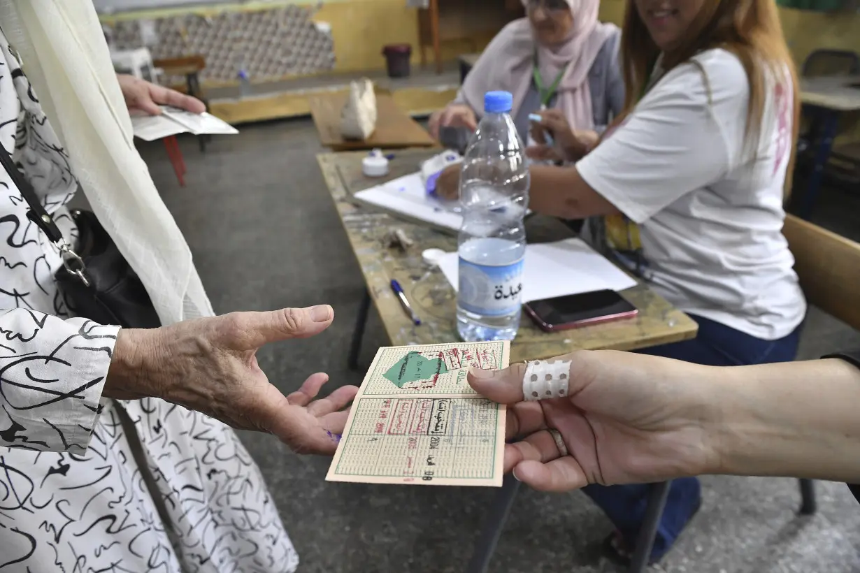 Algeria's president joins opponents in claiming election irregularities after being named the winner