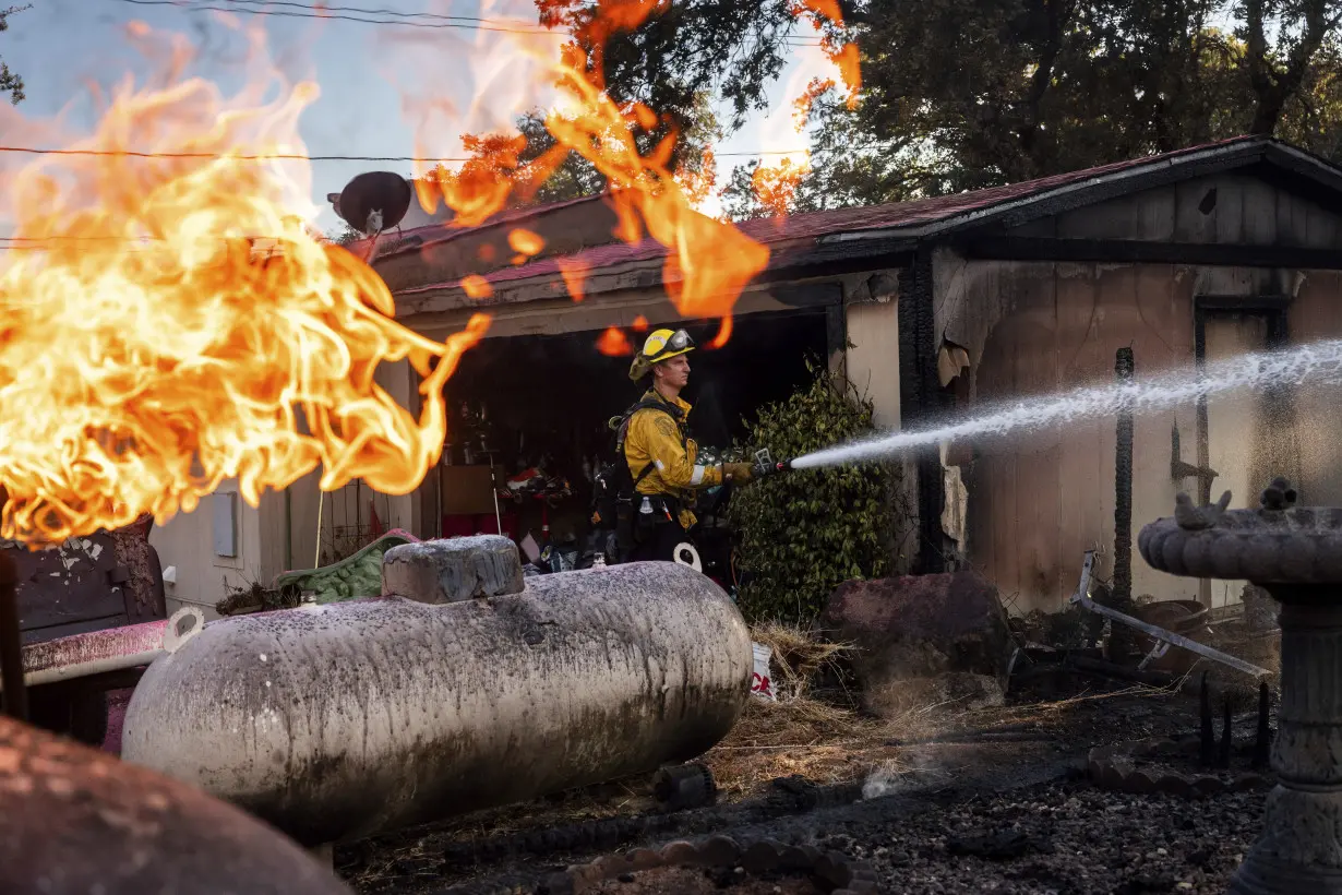 Lightning could worsen wildfire east of LA already threatening 35,000 homes and buildings