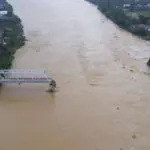 Bridge collapses as more rain falls in Vietnam and storm deaths rise to 21