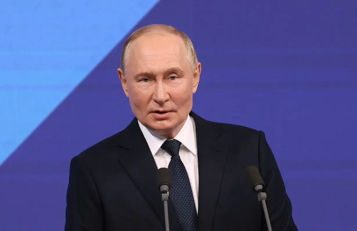 Russian President Putin addresses the audience before a concert in Moscow