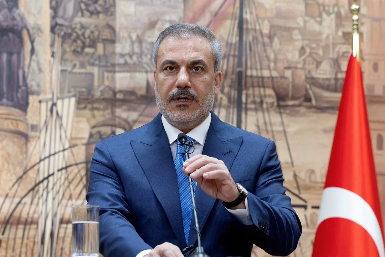 FILE PHOTO: Turkish Foreign Minister Hakan talks during a press conference in Istanbul