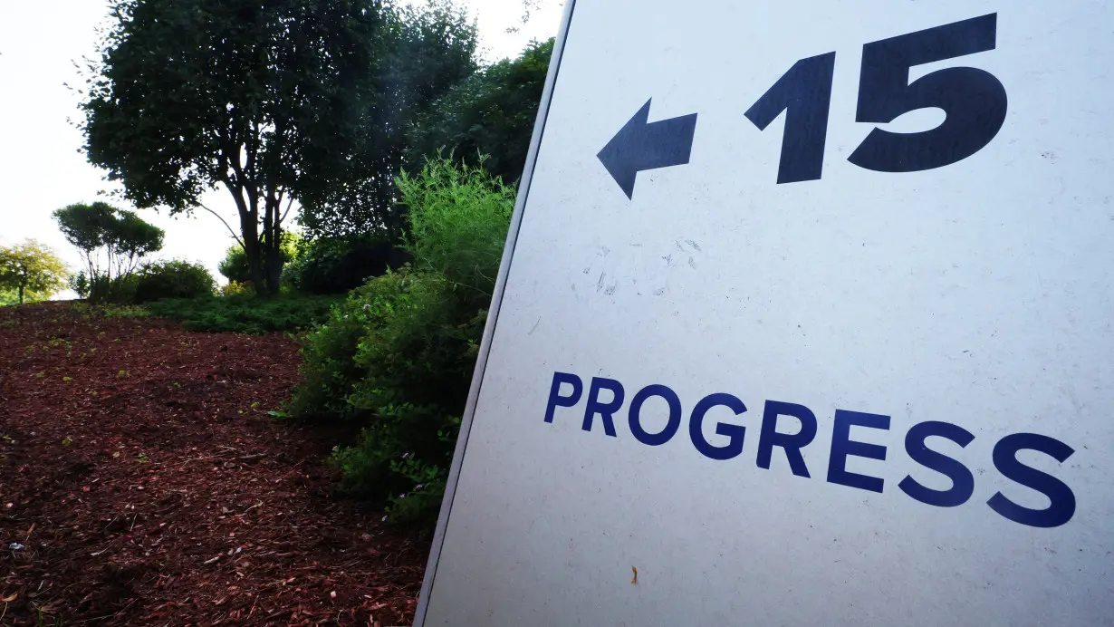 A sign indicates the direction to the offices of Progress Software in Burlington