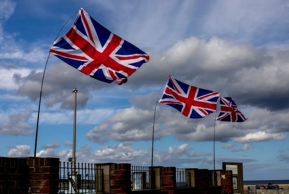 Union Jack flags flutter at the Roker Beach in Sunderland