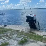 Bystanders hold driver's head above water after crash in Florida