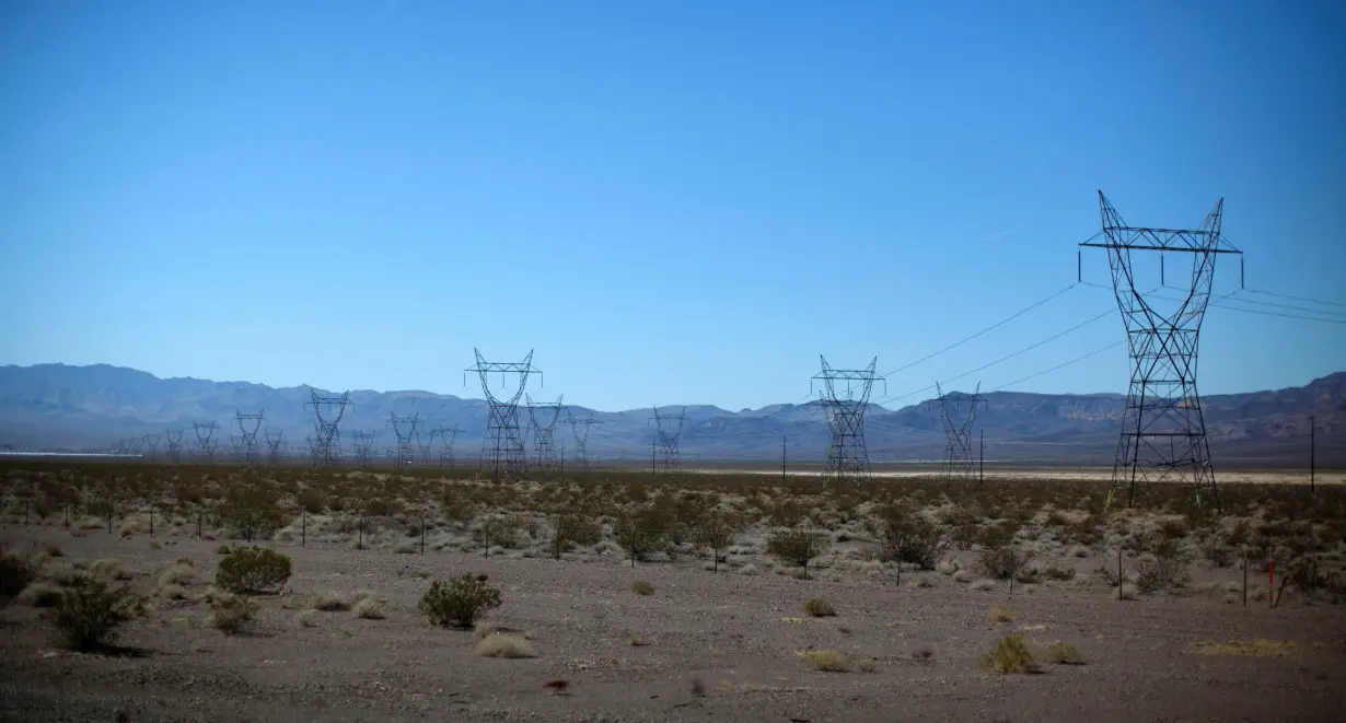 FILE PHOTO: Electricity transmission towers are seen in the Nevada desert near the Copper Mountain Solar Project in Boulder City, Nevada,