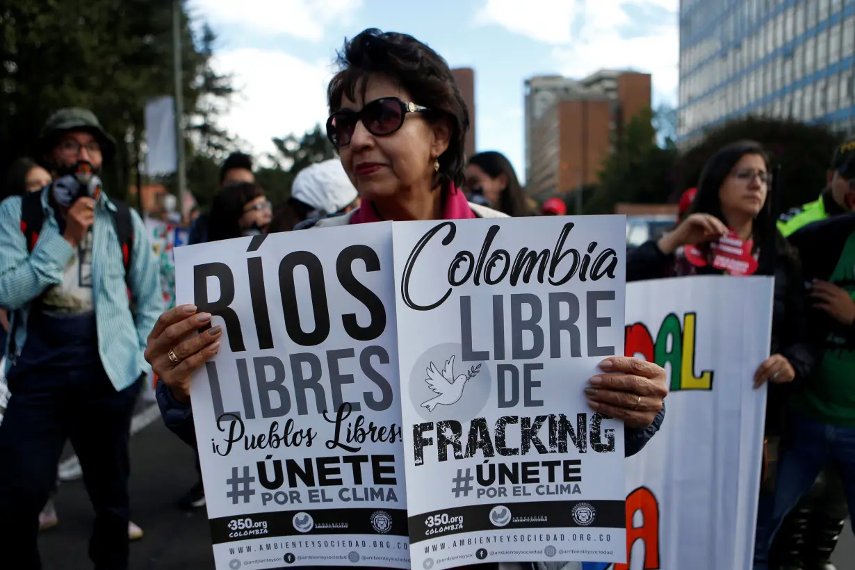 FILE PHOTO: Environmental activists gather to urge world leaders to take action against climate change in Bogota