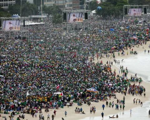 How does the huge crowd for the pope's Mass in East Timor compare to others?