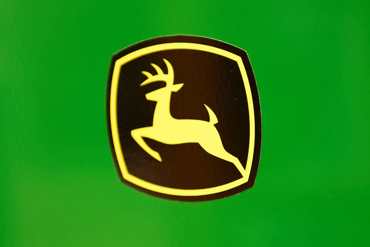 The leaping deer trademark logo is seen on John Deere equipment at a dealership in Taylor, Texas