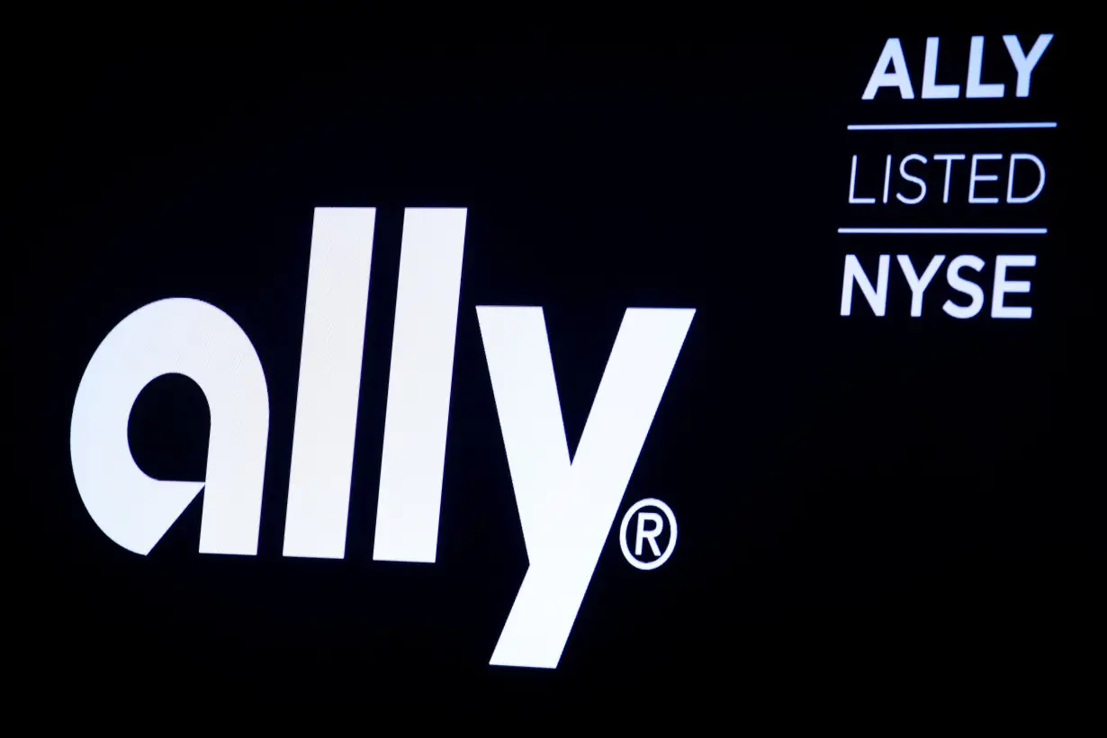 The logo and trading information for Ally Financial Inc appear on a screen on the floor at the NYSE in New York