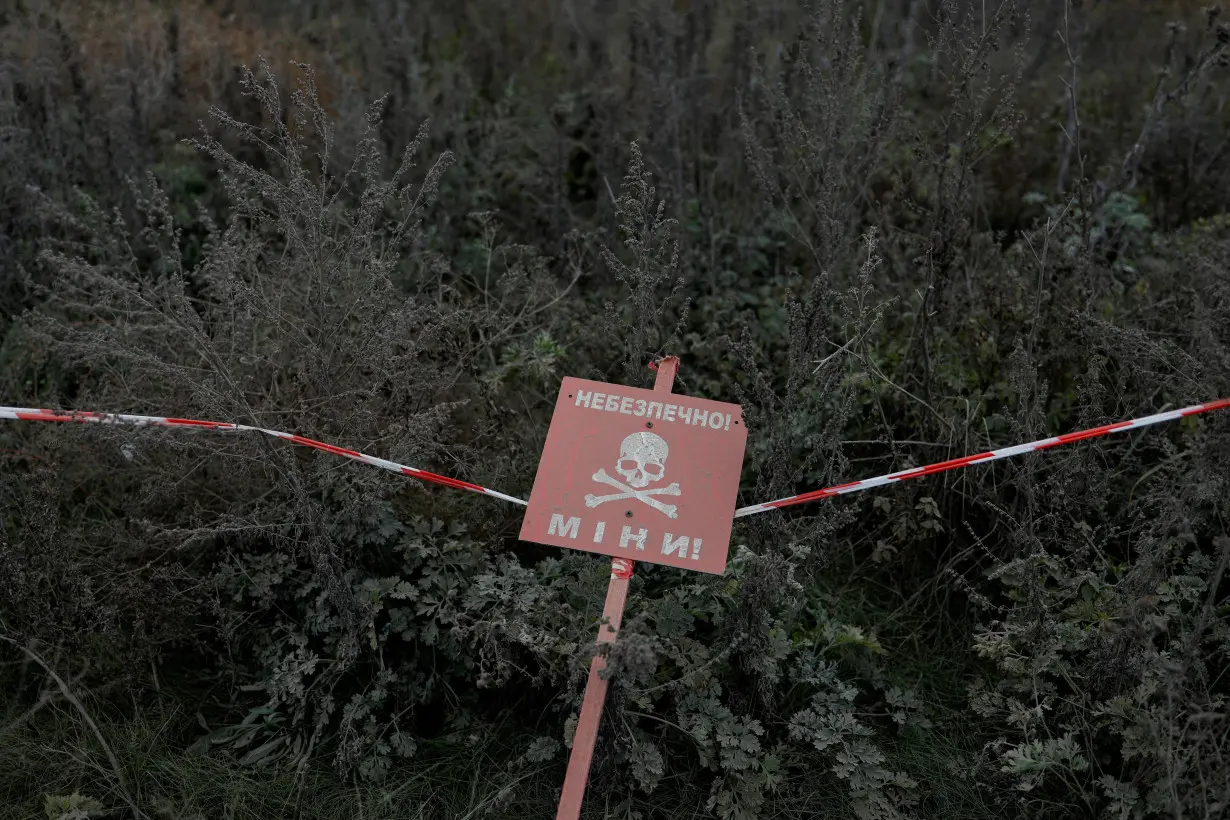 Ukrainian mine experts scan for unexploded ordnance and landmines Kherson region