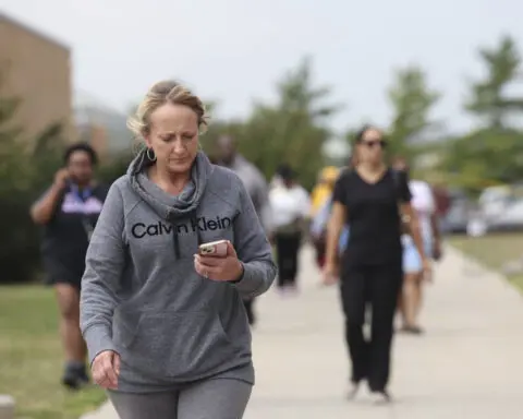 A suspect is in custody after a teen is critically hurt in a shooting at a Nebraska high school