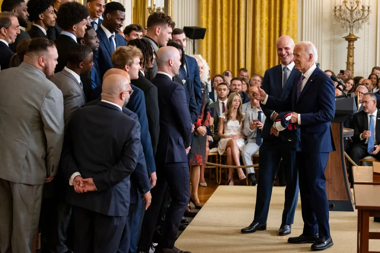 President Joe Biden and University of Connecticut men's basketball head coach Dan Hurley have fun at an event celebrating the Huskies' 2023-2024 NCAA championship.