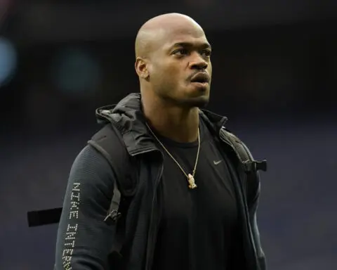 Judge orders former NFL star Adrian Peterson to turn over assets to pay $12M debt