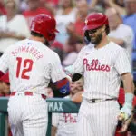 Phils' Schwarber sets MLB single-season mark with 14th leadoff HR before leaving with hurt elbow