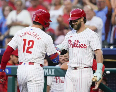 Phils' Schwarber sets MLB mark with 14th leadoff HR of the season before leaving with elbow injury