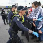 Anti-war protesters clash with police outside Australian arms convention