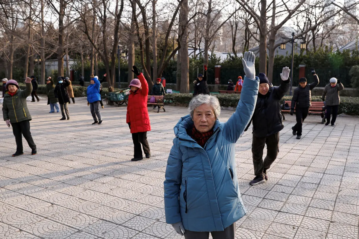 FILE PHOTO: Elderly people dance at a park in Beijing