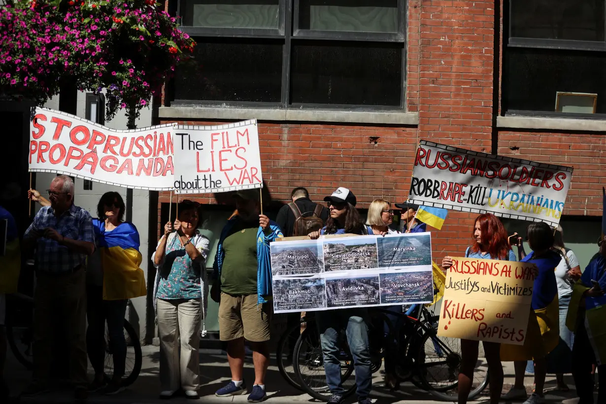 Protesters gather outside the Toronto International Film Festival (TIFF) screening of 'Russians at War', in Toronto