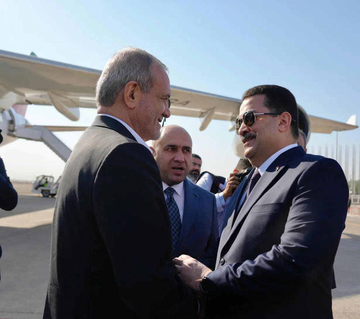 Iraqi Prime Minister Mohammed Shia al-Sudani welcomes Iranian President Masoud Pezeshkian, in Baghdad