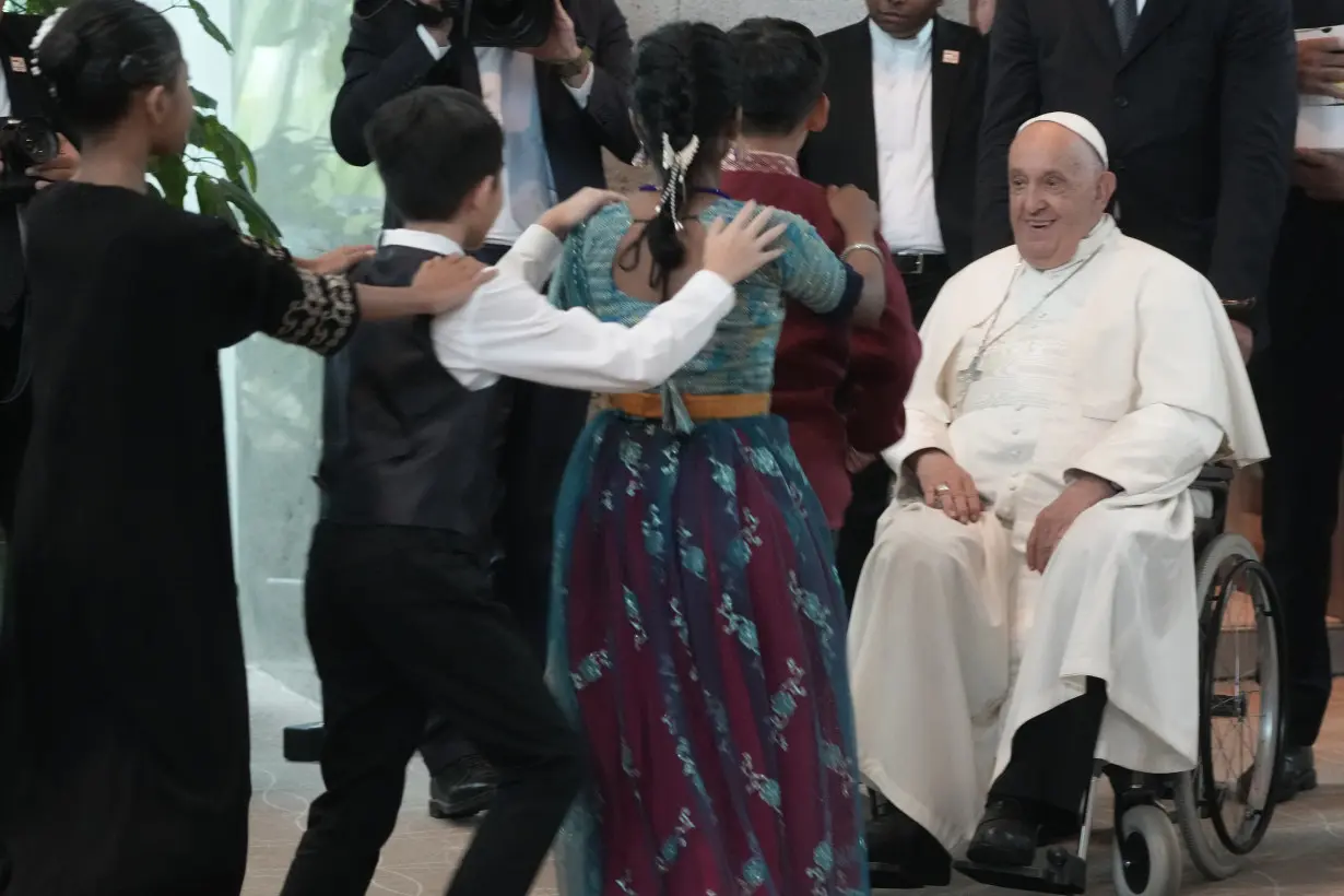 Pope travels from one of the world's poorest countries to one of the richest: Singapore