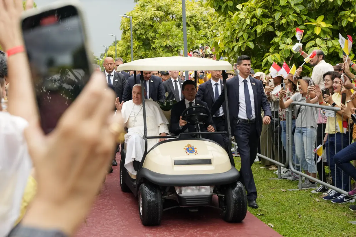 Pope travels from one of the world's poorest countries to one of the richest: Singapore