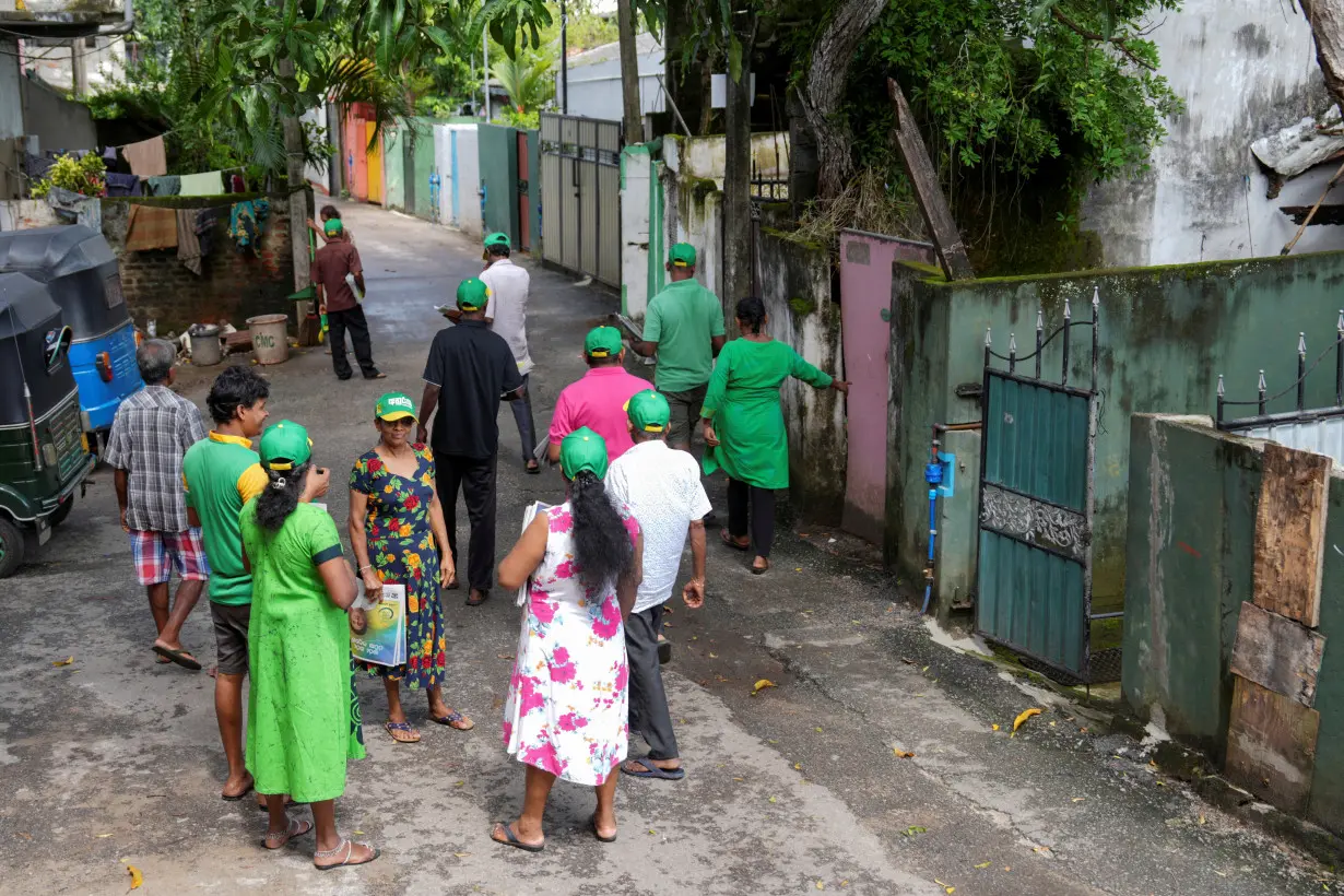 Samudra Jayalath, along with other supporters of the Samagi Jana Balawegaya (SJB) party take part in an election campaign for the upcoming presidential election, in Colombo