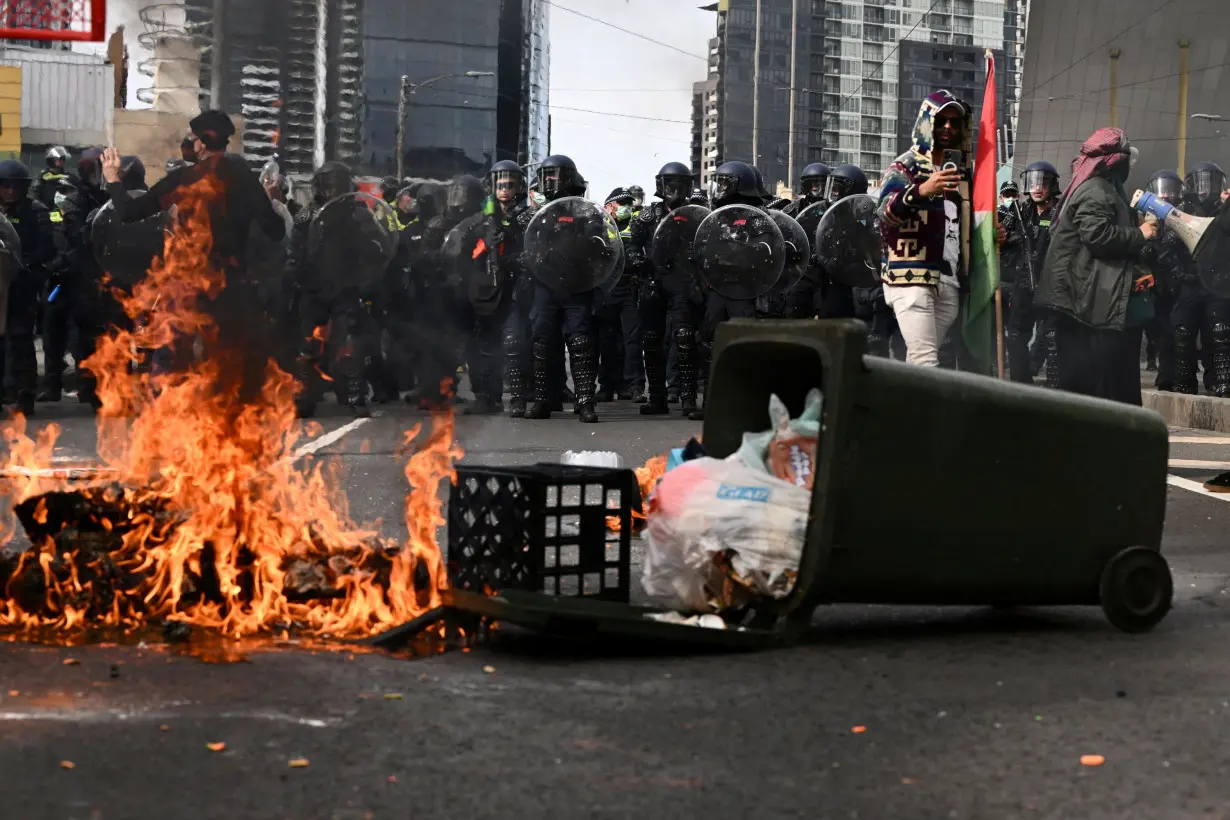 Protesters clash with police at Australia defense show